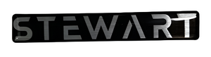 Metallic 'STEWART' logo on a reflective surface