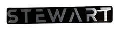 Image of Metallic 'STEWART' logo on a reflective surface